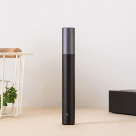 Smart nose hair trimmer with sleek design, representing app-connected grooming innovation