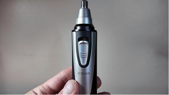 This nose hair trimmer (held in hand) could be due for replacement—one warning sign is if it no longer performs as smoothly as its sleek build suggests.